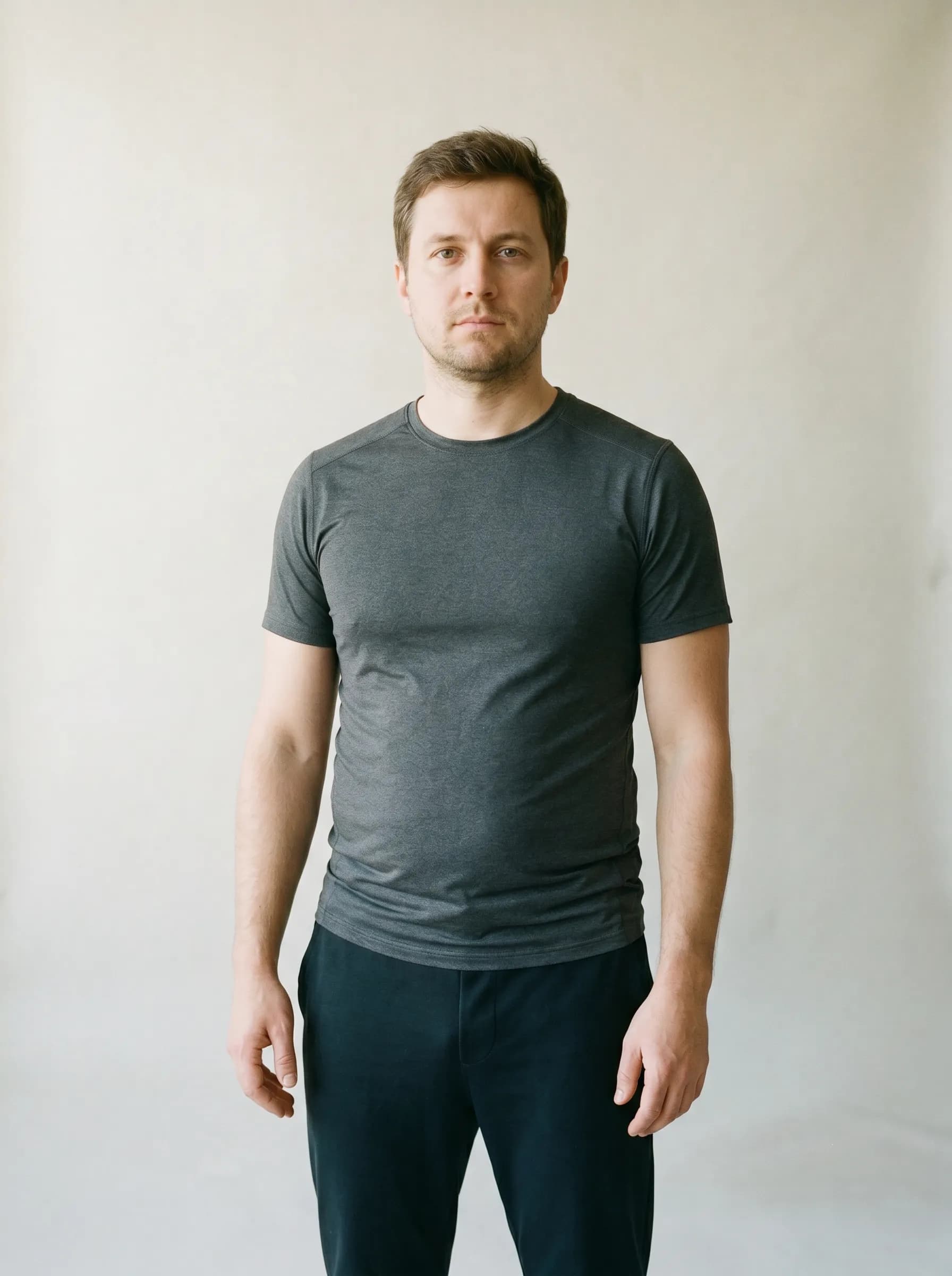 Editorial reconstruction of Dimitri at baseline before thyroid treatment, neutral studio backdrop