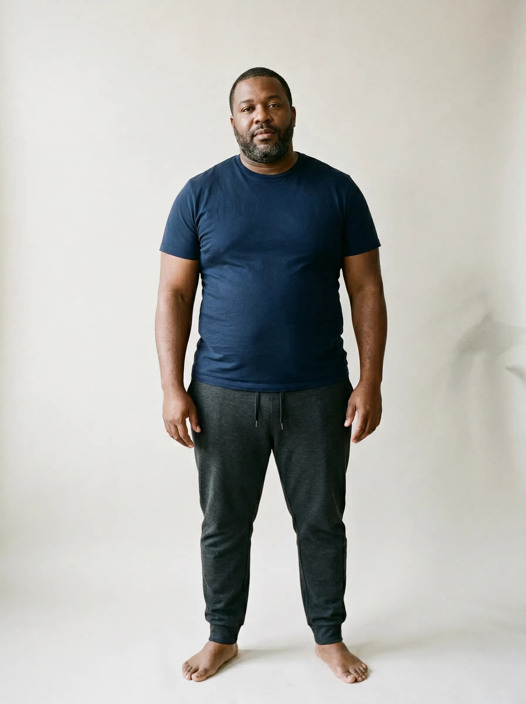 Editorial reconstruction of Reggie at baseline before tirzepatide titration, neutral studio backdrop